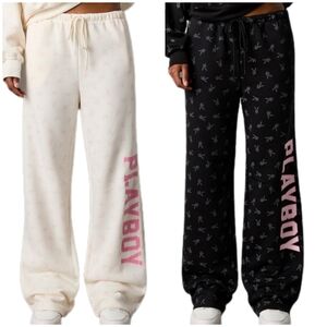2 Playboy sweatpants, L black+white, playboy bunny all over and pink writing.